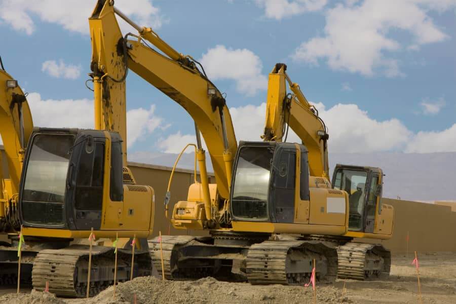 2 large yellow JCBs on construction site requiring security protection from theft and vandalism