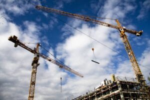 Construction site security with big large cranes in the background