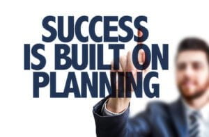A man writing success is built on planning to support how to tips for running effective threat drills