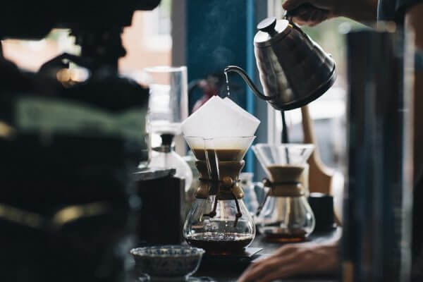 Close up of someone poring coffee through a filter