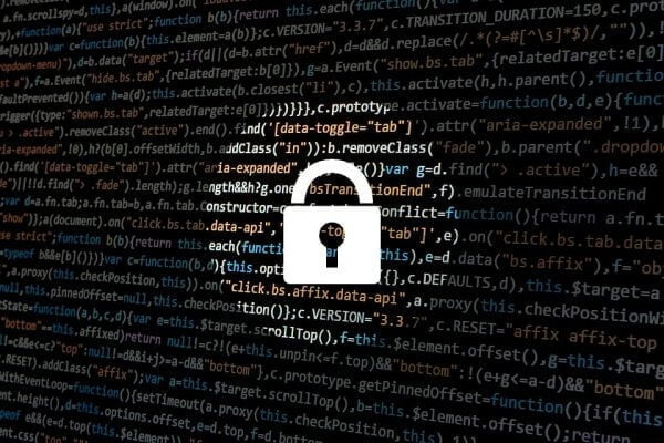 A lock with computer code behind it