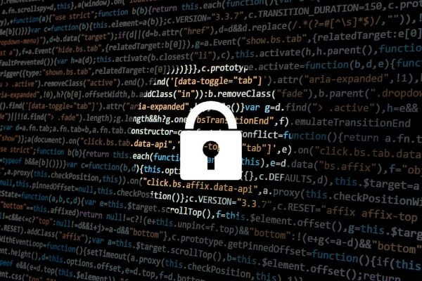 A lock with computer code behind it