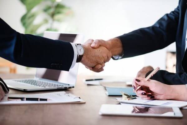 Two business men shaking hands