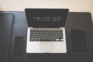 iphone, mac book and ipad on desk to illustrate how such devices can compromise your business and home security