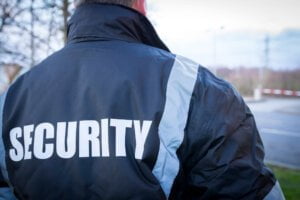 Security Guard overseeing security barrier of factory unit