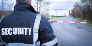 a security officer guarding the premises as part of an emergency security cover strategy