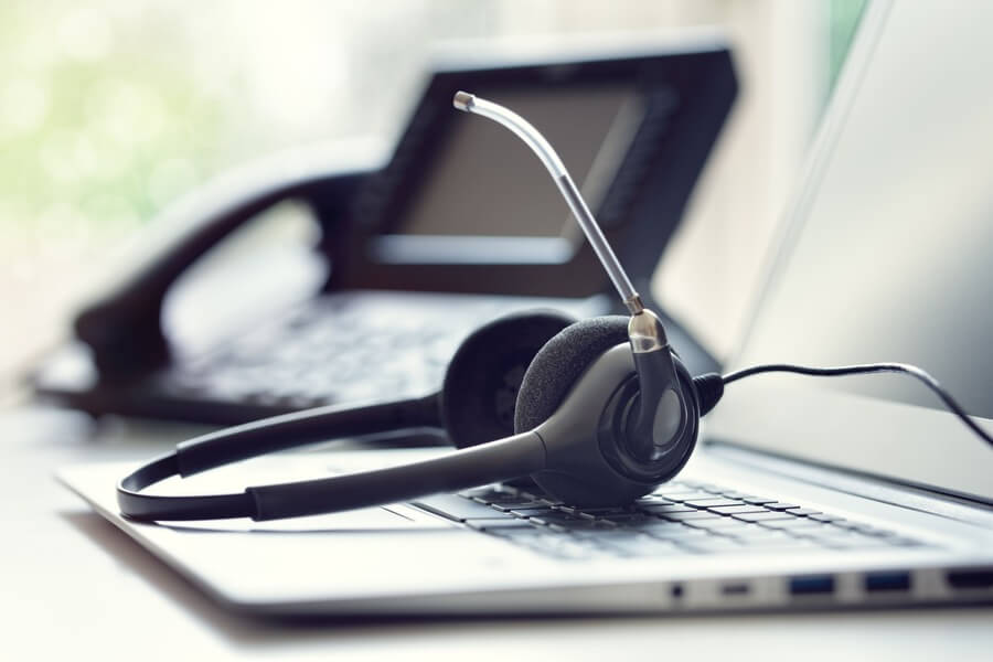 Customer services phone head set and laptop