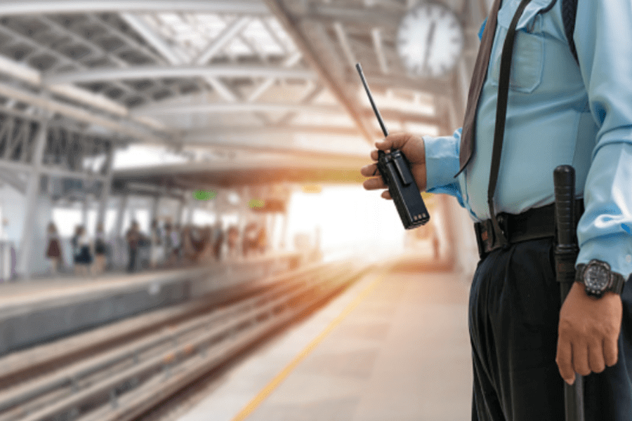 Mobile security guard with radio patrolling railway station