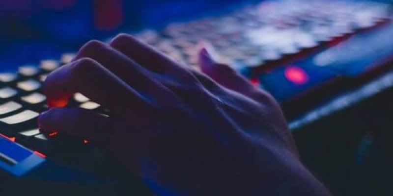 close up of a hand on a computer keyboard to depict a hacker hacking a system to access confidential data