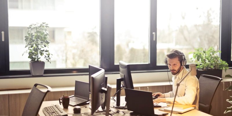 male employee working at a desk to depict whether staff sabotage is part of your security strategy