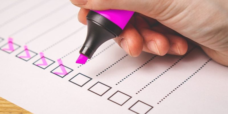 checklist with ticked boxesusing pink marker pen to illustrate whetherI Your business Security is Protecting Your Assets or Just Ticking the Boxes