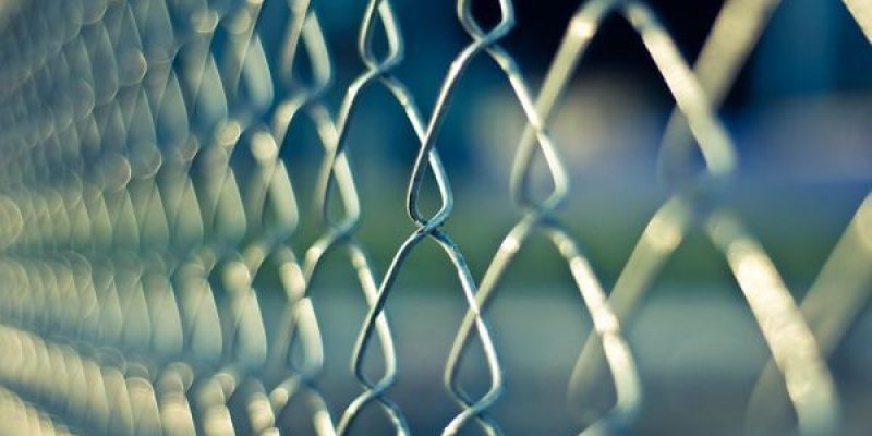Image of chainlink fence to illustrate risk assessment steps to protect your business in the New Year