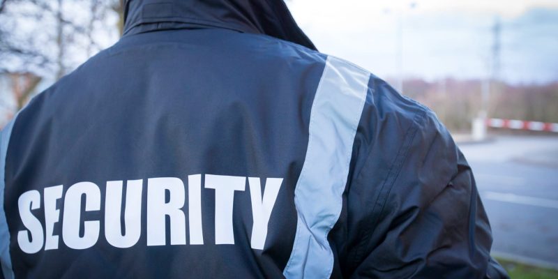 Security Guard overseeing security barrier of factory unit