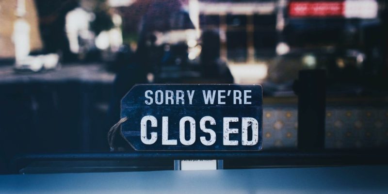 sorry we are closed sign in a shop window and steps you need to take to secure your premises during lockdown
