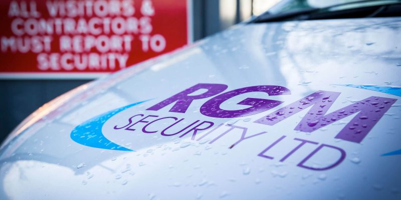 RGM Security vehicle with company logo emblazoned on the bonnet waiting at the entrance of factory unit site